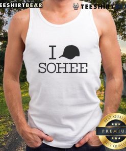 Sohee wearing a stylish Good I Hat cap and tank top, showcasing trendy summer fashion in a vibrant outdoor setting.