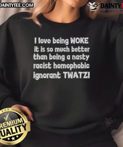 Person wearing 'Good I Love Being Woke' sweatshirt, promoting inclusivity and rejecting racism and homophobia.