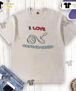 Good I Love Crotch Eating washed t-shirt displayed on a hanger, showcasing its unique design and vibrant colors.