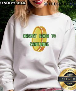 Gold Pixel sweatshirt featuring 'Good Insert Coin to Continue' graphic, perfect for retro gaming enthusiasts.