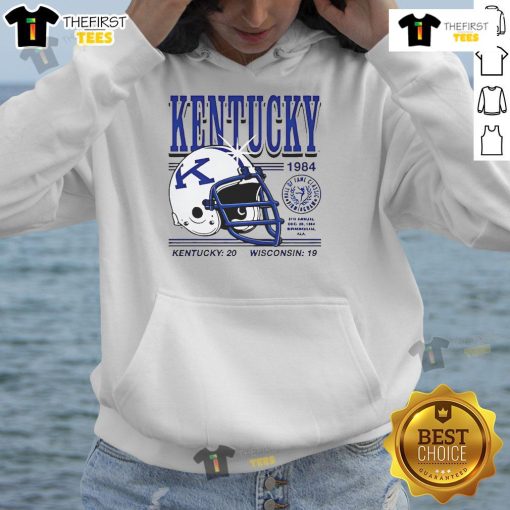 1984 Kentucky Wildcats helmet design on a hoodie, celebrating Kentucky's 20-19 victory over Wisconsin.