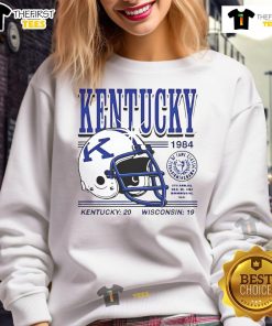Good Kentucky Wildcats helmet from the 1984 game, featuring the score Kentucky 20, Wisconsin 19 on a sweatshirt.
