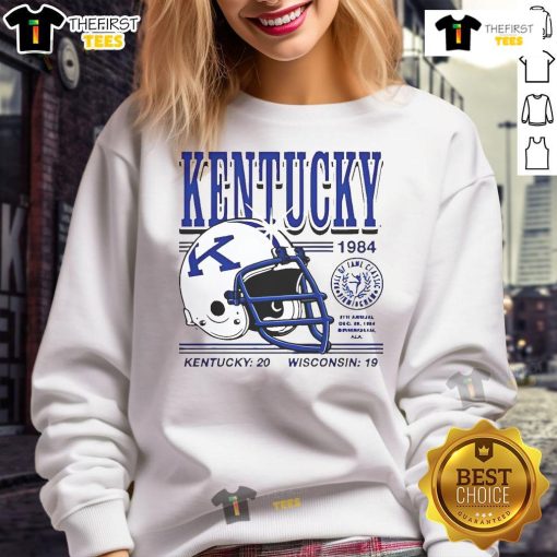 Good Kentucky Wildcats helmet from the 1984 game, featuring the score Kentucky 20, Wisconsin 19 on a sweatshirt.
