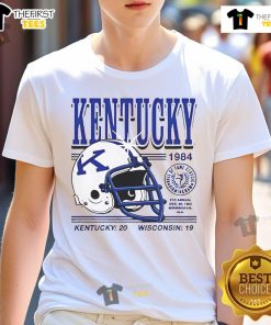 1984 Kentucky Wildcats helmet graphic on a T-shirt celebrating Kentucky 20 Wisconsin 19 football game victory.