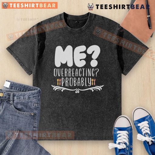 Person wearing a 'Good Me' t-shirt, humorously overreacting, showcasing a playful take on self-awareness and expression.