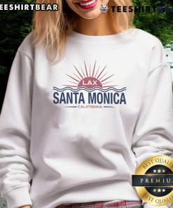 Cozy 'Good Santa Monica Destination' sweatshirt displayed on a wooden background, perfect for beach lovers and travelers.