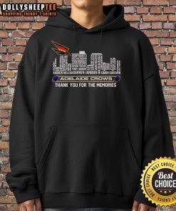Alt Text: Adelaide Crows 'Thank You For The Memories' hoodie in front of a vibrant skyline, showcasing team spirit and style.