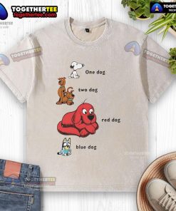 Good Snoopy dog in a red and blue washed t-shirt, showcasing adorable playful vibes of two happy dogs.