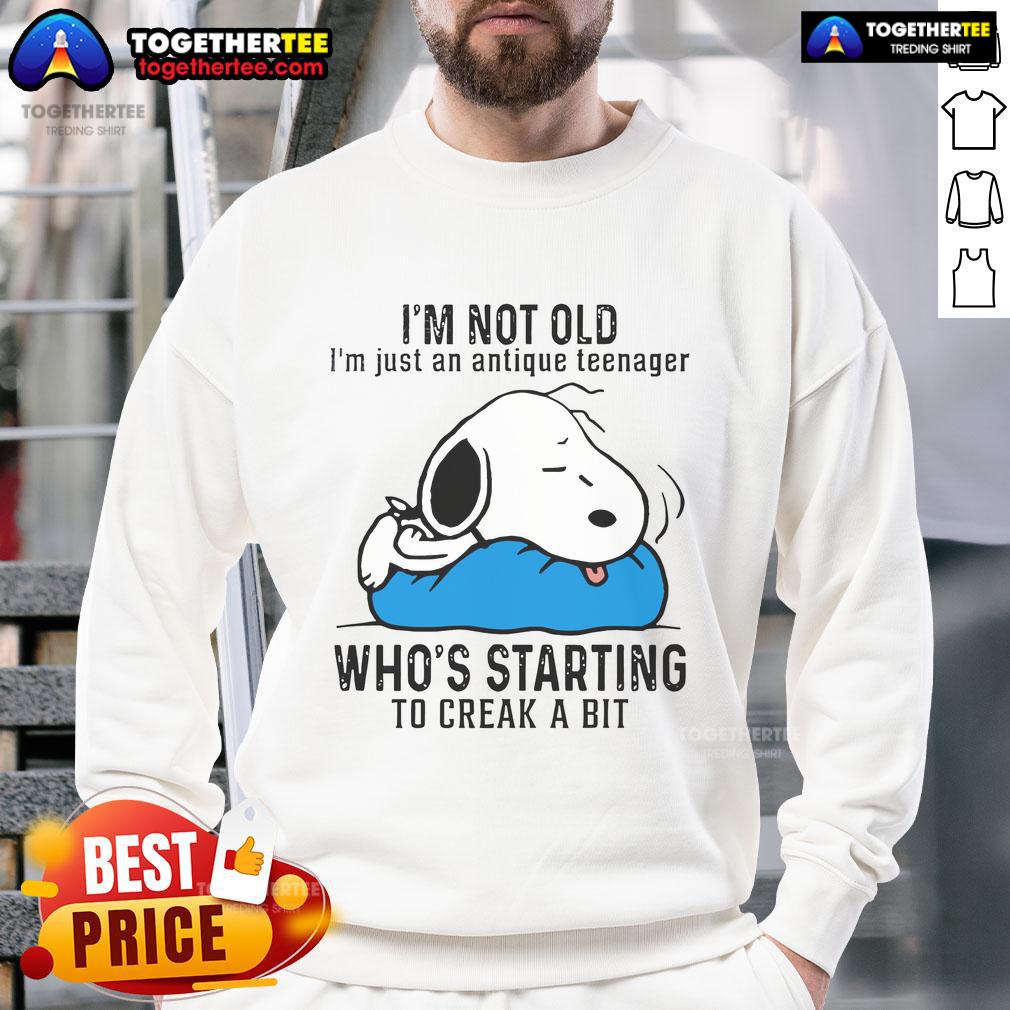Good Snoopy I'm Not Old I'm Just An Antique Teenager Who's Starting To Creak A Bit Sweatshirt Funny Snoopy sweatshirt with 'I'm not old, I'm just an antique teenager' design, perfect for vintage style lovers.