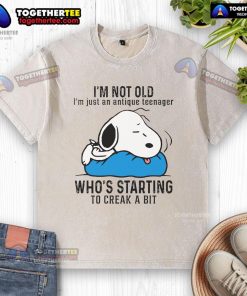 Vintage Snoopy t-shirt saying 'I'm not old, I'm just an antique teenager' with a playful design, perfect for nostalgic fans.