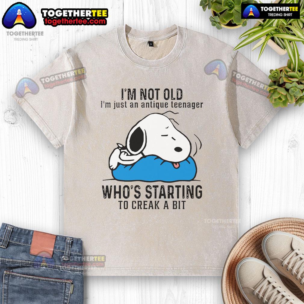 Good Snoopy I'm Not Old I'm Just An Antique Teenager Who's Starting To Creak A Bit Washed T-Shirt Vintage Snoopy t-shirt saying 'I'm not old, I'm just an antique teenager' with a playful design, perfect for nostalgic fans.