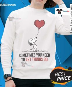 Good Snoopy sweatshirt featuring 'Sometimes You Need to Let Things Go' design, perfect for casual wear and inspiration.