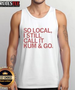 Person wearing a 'Good-So-Local-I-Still-Call-It-Kum-And-Go' tank top, showcasing local pride and casual style.