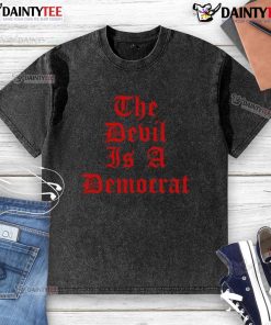 Good The Devil Is A Democrat washed t-shirt featuring bold text design, perfect for political and casual wear.