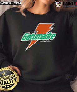 Good Will Kelly wearing an orange peel Gatorade sweatshirt with free refills logo, showcasing a vibrant and trendy style.