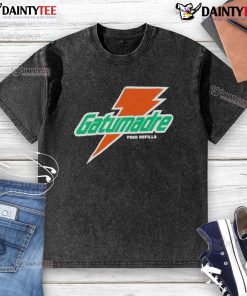 Good Will Kelly wearing an orange peel Gatorade logo t-shirt with 'Free Refills' print in a casual setting.