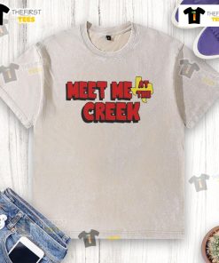 Happy Billy Strings Co. Meet Me At The Creek washed t-shirt displayed on a wooden background, showcasing vibrant colors.