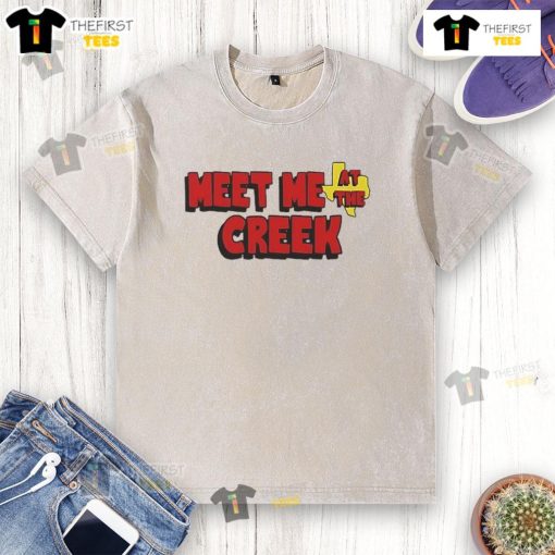 Happy Billy Strings Co. Meet Me At The Creek washed t-shirt displayed on a wooden background, showcasing vibrant colors.