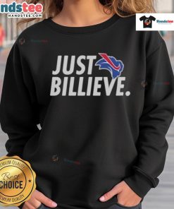 Happy Eric Wood wearing a Just Billieve sweatshirt, showcasing a vibrant design and positive message.