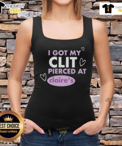 Happy person in a tank top celebrating getting their clit pierced at Claries, showcasing joy and body positivity.