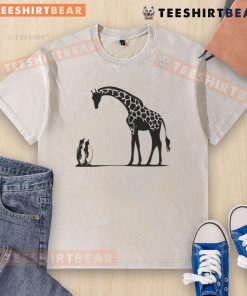 Alt Text: Happy penguin and giraffe on a tall and small washed t-shirt, perfect for kids' playful fashion.