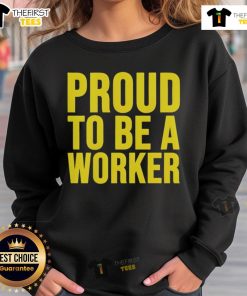 Happy worker wearing a 'Proud to Be a Worker' sweatshirt for Labour Day 2025, celebrating hard work and dedication.