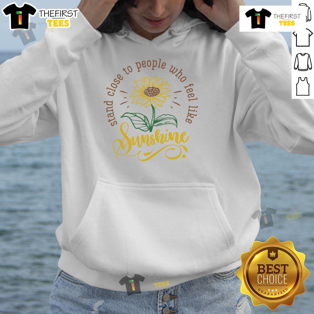 Happy Stand Close To People Who Feel Like Sunshine Hoodie Happy person wearing a 'Feel Like Sunshine' hoodie, standing close to friends outdoors, radiating positivity and joy.