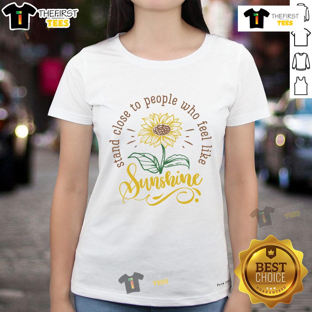 Happy Stand Close To People Who Feel Like Sunshine Ladies Tee Cheerful women in 'Happy Stand Close to People Who Feel Like Sunshine' tee, radiating positivity and joy outdoors.