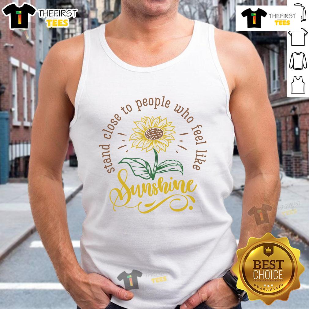Happy Stand Close To People Who Feel Like Sunshine Tank Top Happy person wearing 'Feel Like Sunshine' tank top, standing close to friends in a sunny outdoor setting, radiating joy.