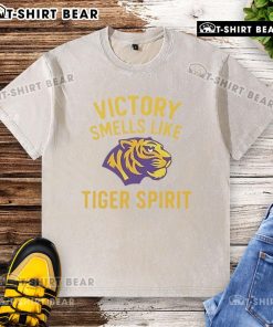 Happy Victory Smells Like Tiger Spirit washed t-shirt displayed on a wooden surface, showcasing vibrant colors and design.