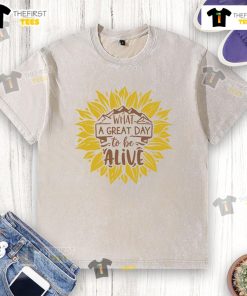 Alt Text: Happy What A Great Day To Be Alive sunflower washed t-shirt featuring vibrant sunflower design on soft fabric.