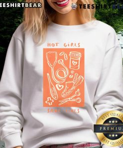 Hot Girls Save Lives sweatshirt featuring a nurse in medical scrubs, promoting healthcare worker pride and support.