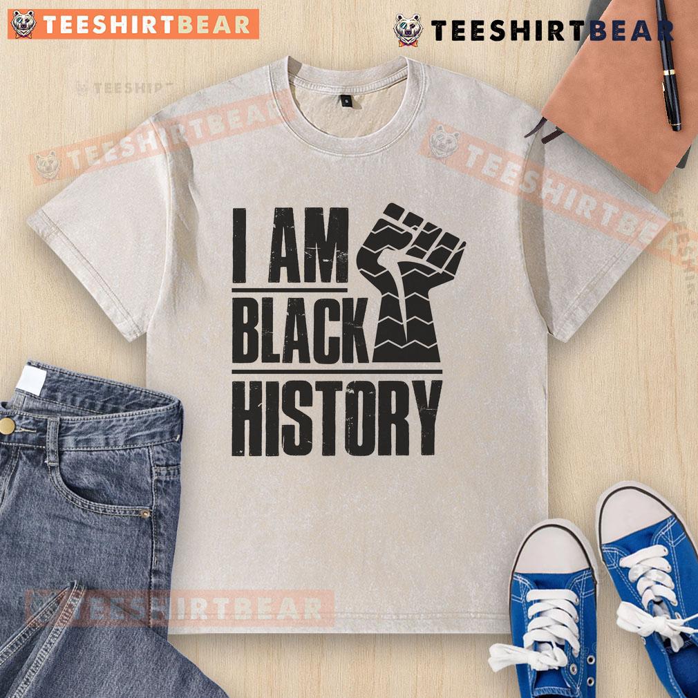 Hot I Am Black History Fist Washed T Shirt Alt Text: Hot I Am Black History Fist Washed T-Shirt featuring a bold fist graphic celebrating Black history and culture.