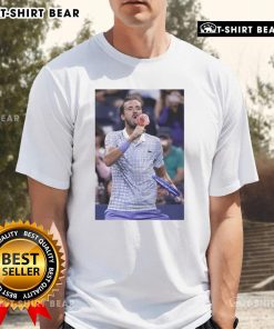 Hot Medvedev enjoying ice cream on the field, wearing a US Open T-shirt, captures a fun moment at the tournament.