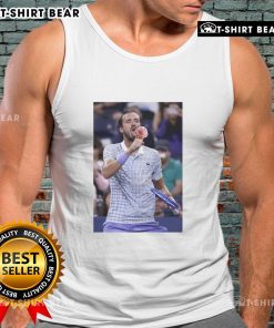 Daniil Medvedev enjoying ice cream on the field at the US Open, wearing a tank top and celebrating his victory.