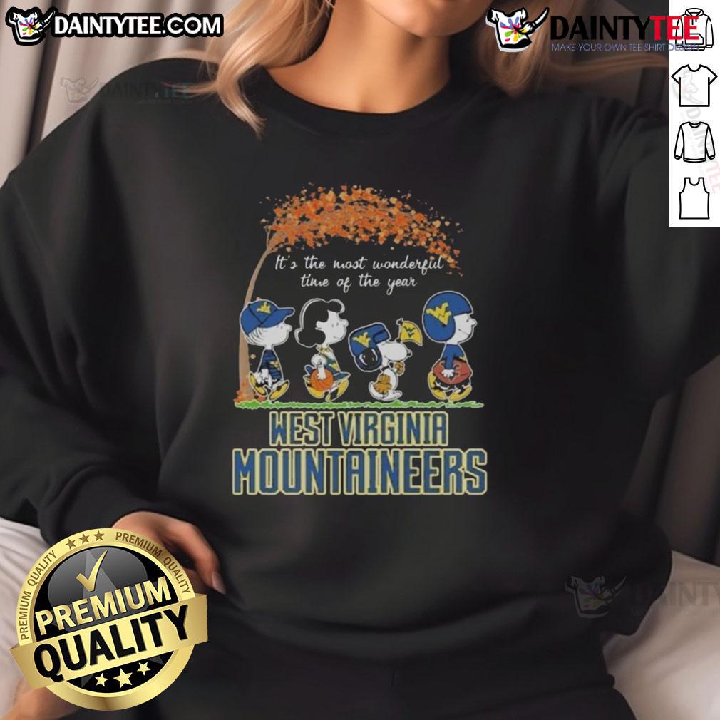 Hot Snoopy The Peanuts X Michigan Wolverines It's The Most Wonderful Time Of The Year Sweatshirt Alt Text: Hot Snoopy The Peanuts x Michigan Wolverines sweatshirt for the holidays, perfect for festive fans.