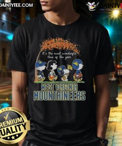 Alt Text: Hot Snoopy The Peanuts X Michigan Wolverines T-shirt featuring festive design, perfect for holiday cheer and sports fans.