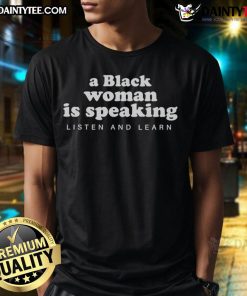 Black woman wearing 'Listen and Learn' T-shirt, promoting empowerment and education in a vibrant setting.