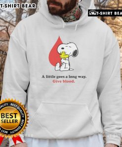Snoopy hoodie with 'Nice-A-Little-Goes-A-Long-Way-Give-Blood' print, promoting blood donation awareness.