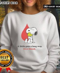 Nice A Little Goes A Long Way Give Blood Snoopy Sweatshirt featuring Snoopy promoting blood donation in a cozy design.