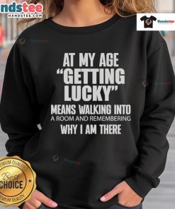 Cozy sweatshirt with 'Getting Lucky Means Walking Into A Room And Remembering' text design for all ages.