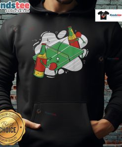 Nice beer bottles and a ping pong setup with a stylish hoodie, perfect for a fun game night atmosphere.