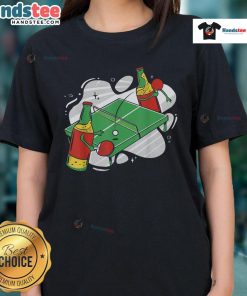Women enjoying a fun ping pong game with nice beer bottles and a vibrant tee, perfect for casual gatherings.