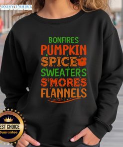 Cozy bonfires with pumpkin spice, flannels, and sweatshirts, perfect for enjoying s'mores on a crisp autumn evening.