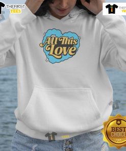 Nice cat wearing a heart hoodie with 'How To Be Human' text, showcasing love and warmth in a cozy setting.