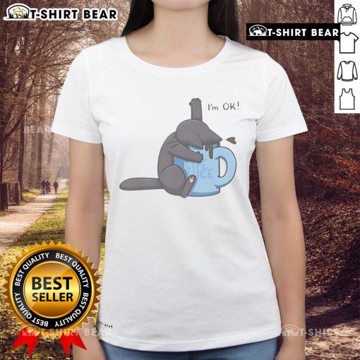 Cute cat playfully drowning in a coffee cup, featured on a humorous I'm Ok ladies tee design. Perfect for cat lovers!