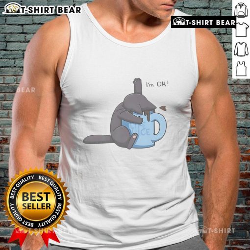 Cute cat playfully submerged in a coffee cup, wearing an 'I'm OK' tank top, perfect for coffee lovers and cat enthusiasts.