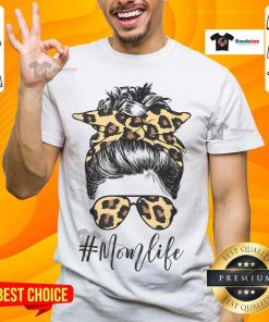 Alt Text: Classy mom wearing a leopard pattern shades t-shirt with a cool messy bun, showcasing stylish mom life.
