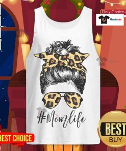 Stylish mom in a tank top with leopard pattern shades and a cool messy bun, embodying nice classy mom life.