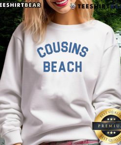 Cozy Nice Cousins Beach sweatshirt worn by friends on a sunny beach, perfect for casual seaside outings.